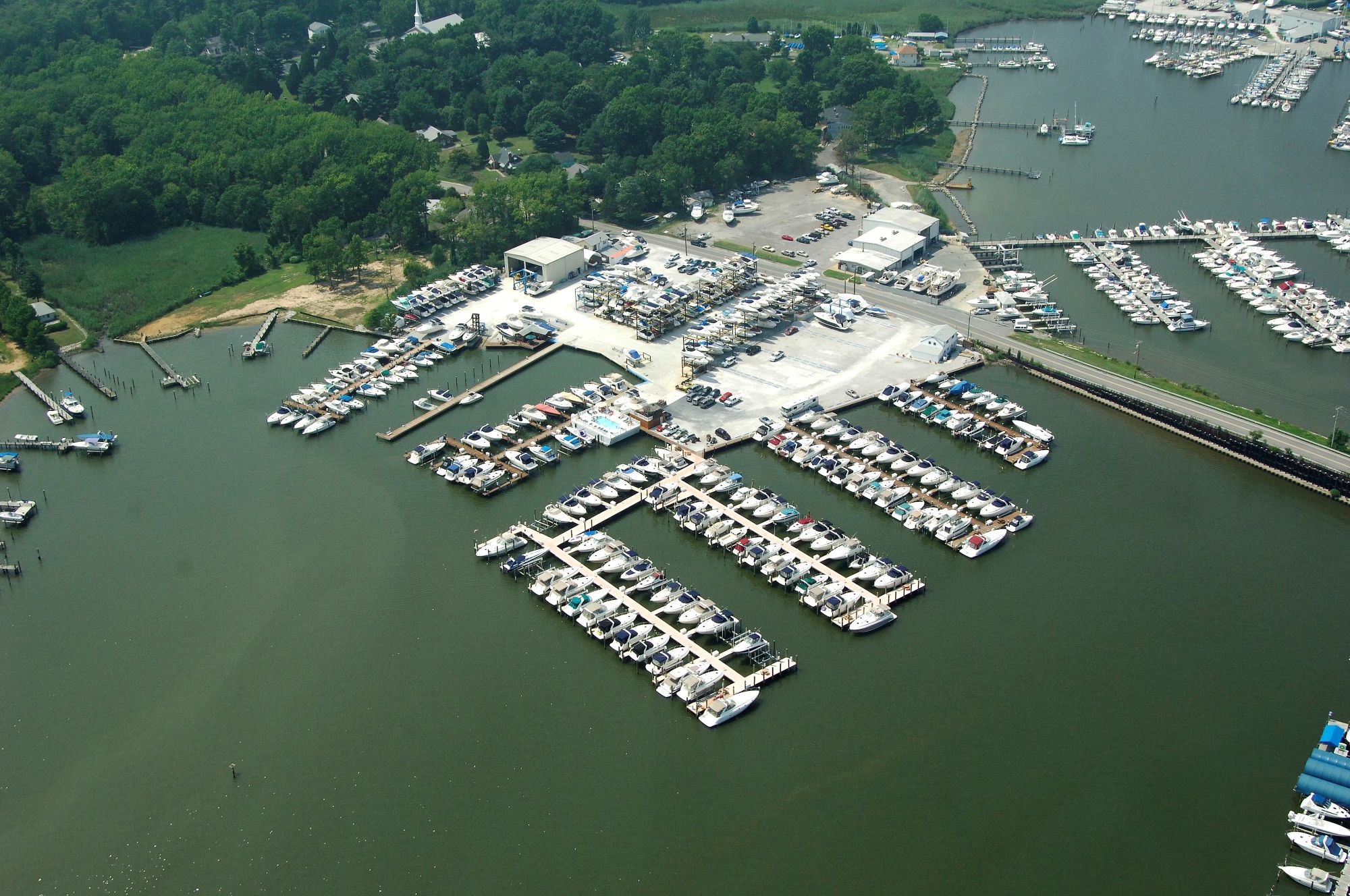 Aerial view of South River Marina showing docks, dry stack storage, and slips on the South River